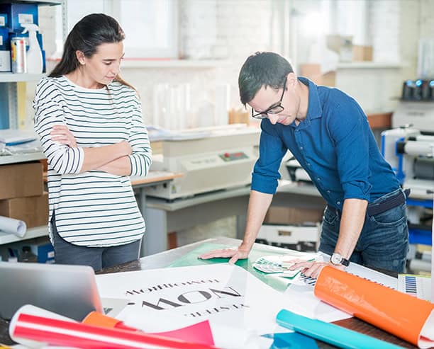 Designers Reviewing Print Layouts