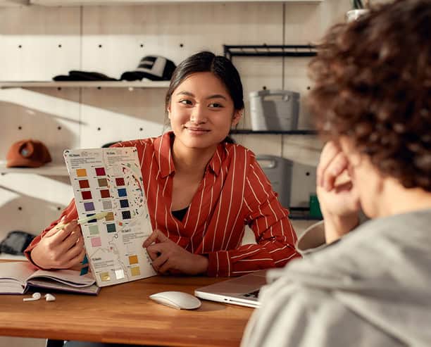 Woman Presenting Color Swatches Design