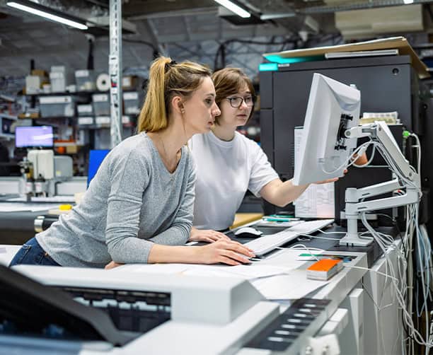 Women Operating Printing Machine Computer